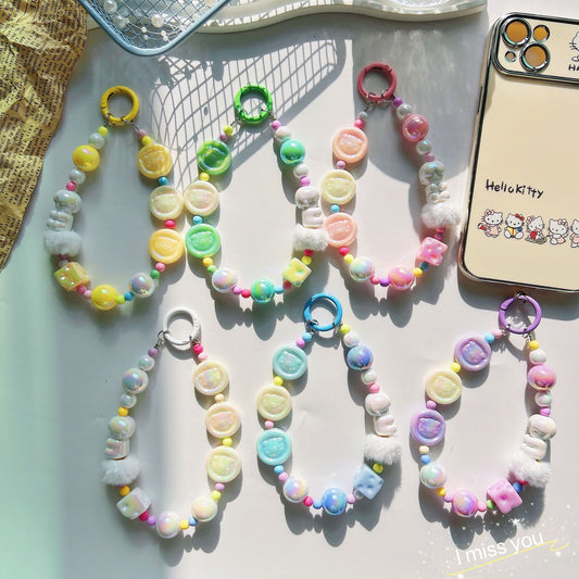 Autumn and winter new pig calcium tablets mobile phone chain colored rice bead string pendant car keychain earphone bag accessories