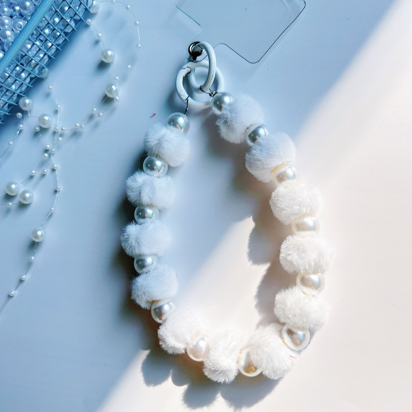 Winter new pom-pom bead string mobile phone chain high-end exquisite mobile phone case bag pendant bag extension chain jewelry