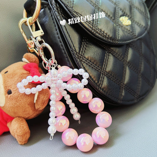 Internet celebrity pearl bow mobile phone chain girl bag exquisite pendant pink bead string wrist rope car keychain