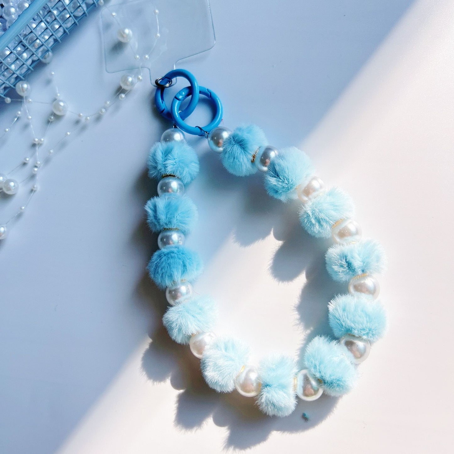 Winter new pom-pom bead string mobile phone chain high-end exquisite mobile phone case bag pendant bag extension chain jewelry