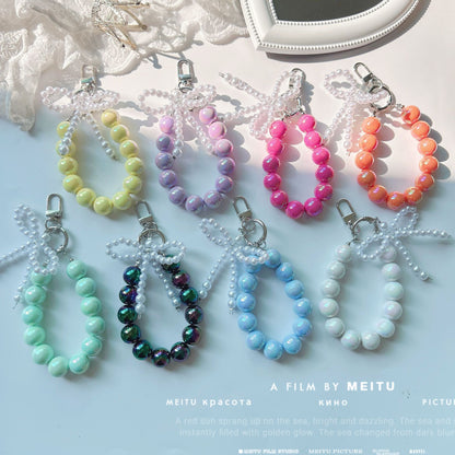 Internet celebrity pearl bow mobile phone chain girl bag exquisite pendant pink bead string wrist rope car keychain