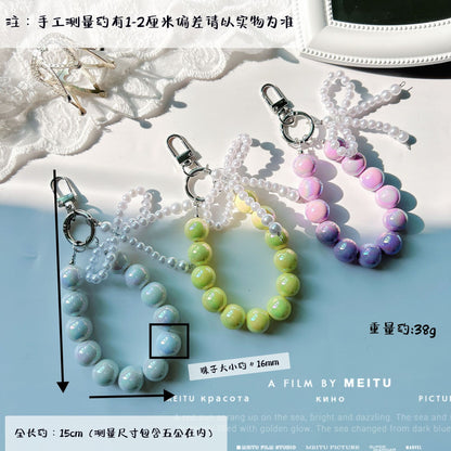 Internet celebrity pearl bow mobile phone chain girl bag exquisite pendant pink bead string wrist rope car keychain