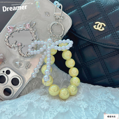 Internet celebrity pearl bow mobile phone chain girl bag exquisite pendant pink bead string wrist rope car keychain