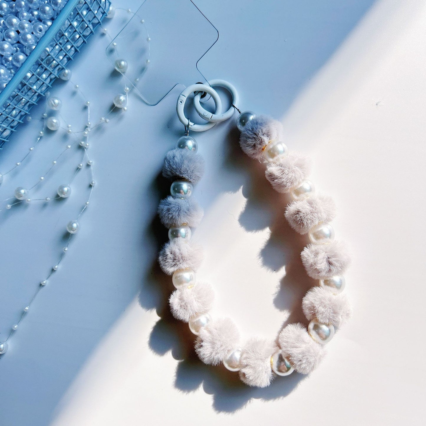 Winter new pom-pom bead string mobile phone chain high-end exquisite mobile phone case bag pendant bag extension chain jewelry