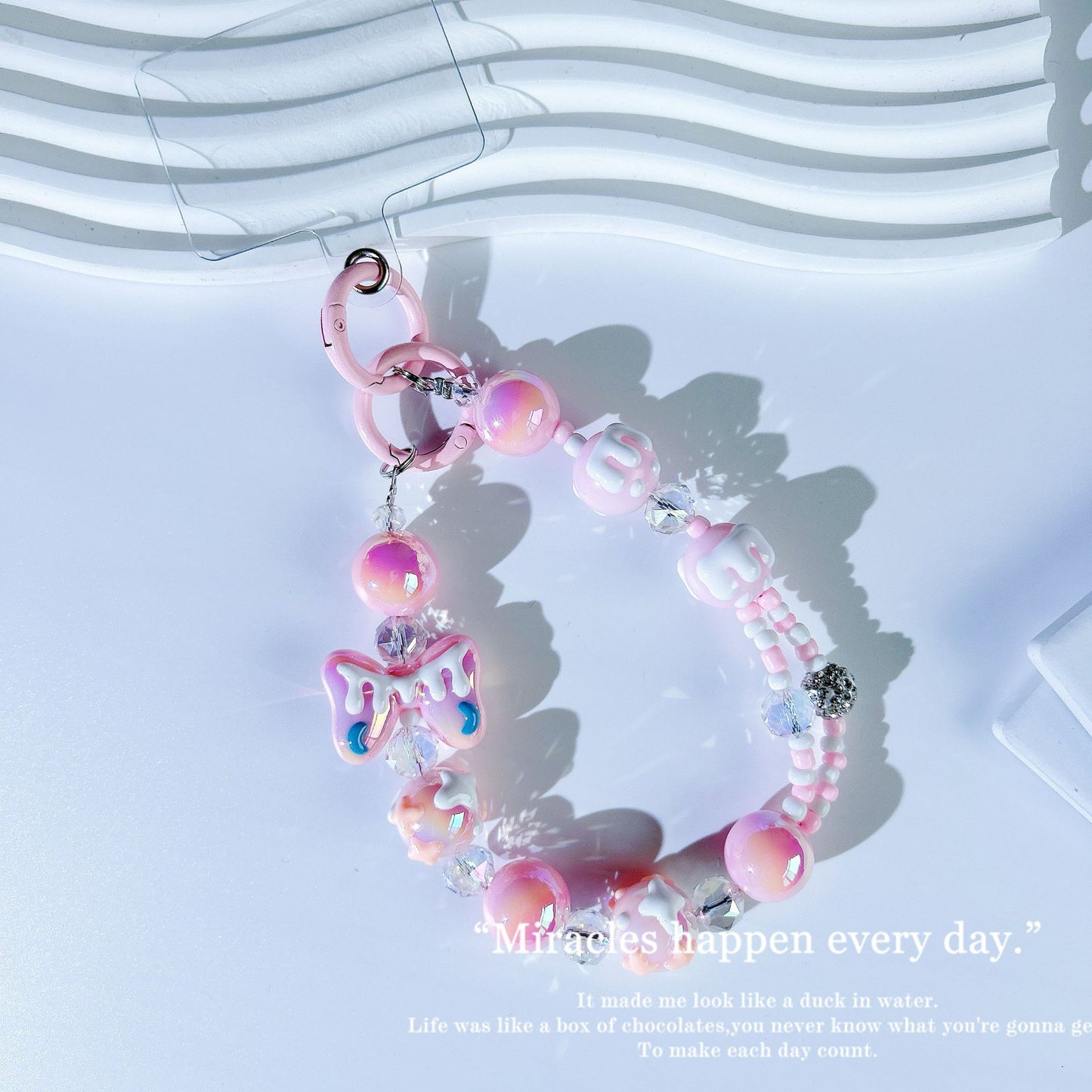 New crystal mobile phone chain pendant graffiti hand-painted bow bead string chain double buckle mobile phone case autumn and winter mobile phone chain