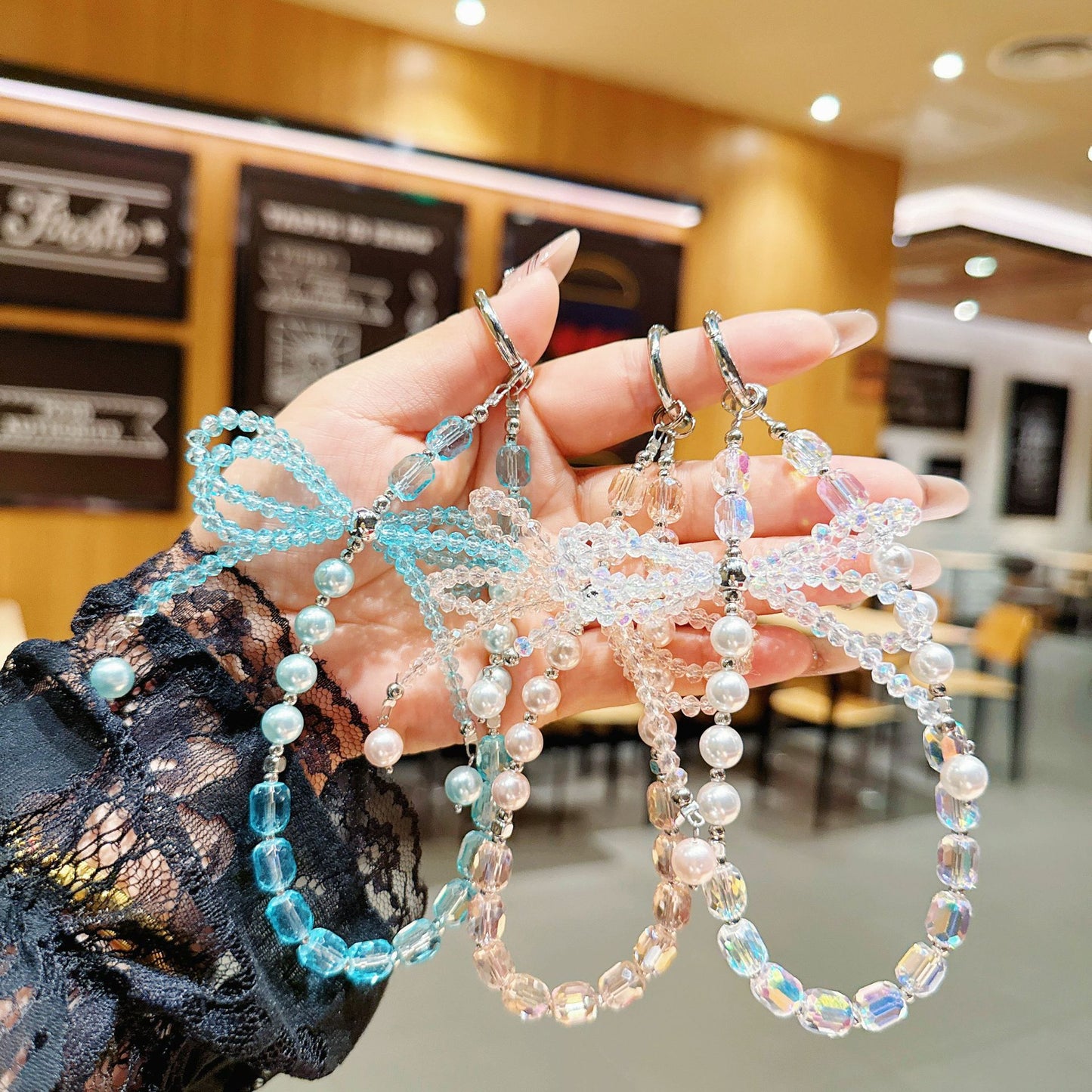 Internet celebrity high sense three-dimensional crystal bow mobile phone chain pendant key lanyard pearl mobile phone lanyard bag chain