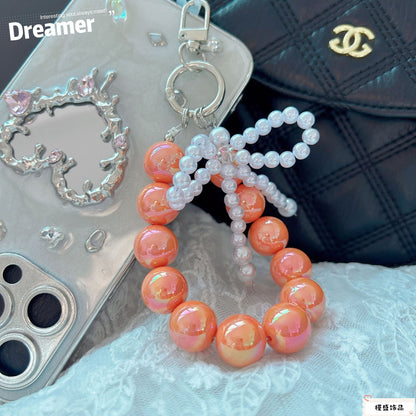 Internet celebrity pearl bow mobile phone chain girl bag exquisite pendant pink bead string wrist rope car keychain