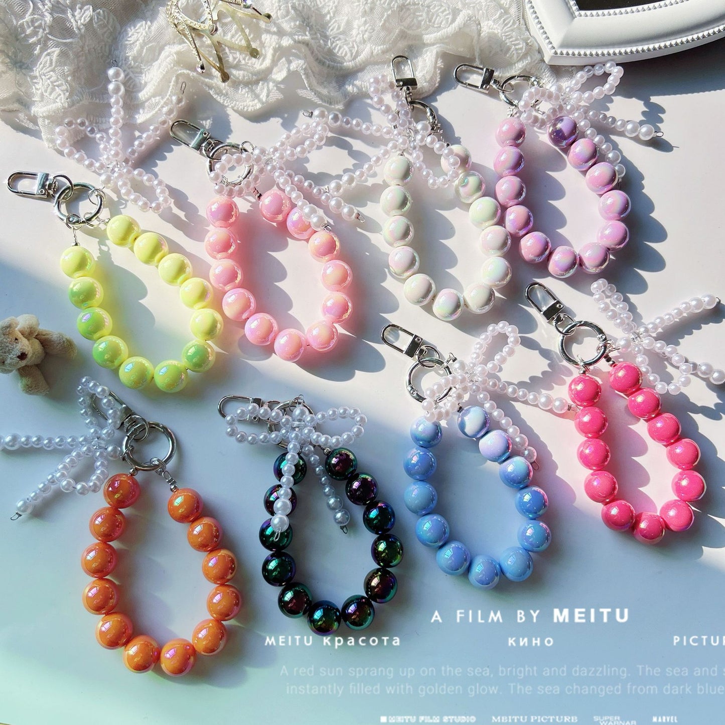 Internet celebrity pearl bow mobile phone chain girl bag exquisite pendant pink bead string wrist rope car keychain