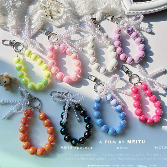 Internet celebrity pearl bow mobile phone chain girl bag exquisite pendant pink bead string wrist rope car keychain