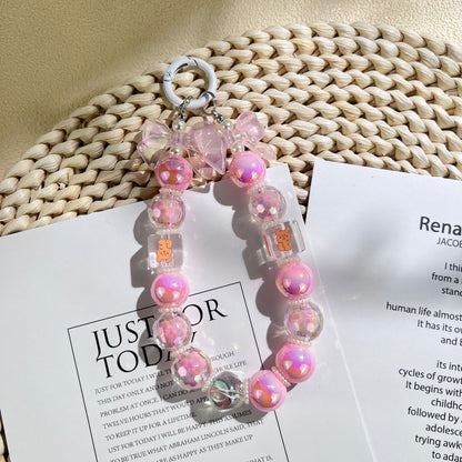 New acrylic bow bead string mobile phone chain keychain pendant DIY bag accessories fashionable and simple style