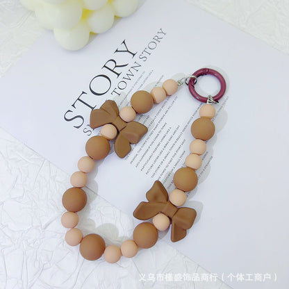 Candy-colored rubber beads smiley face mobile phone pendant bead string keychain live broadcast of the same hanging doll luggage accessories anti-lost