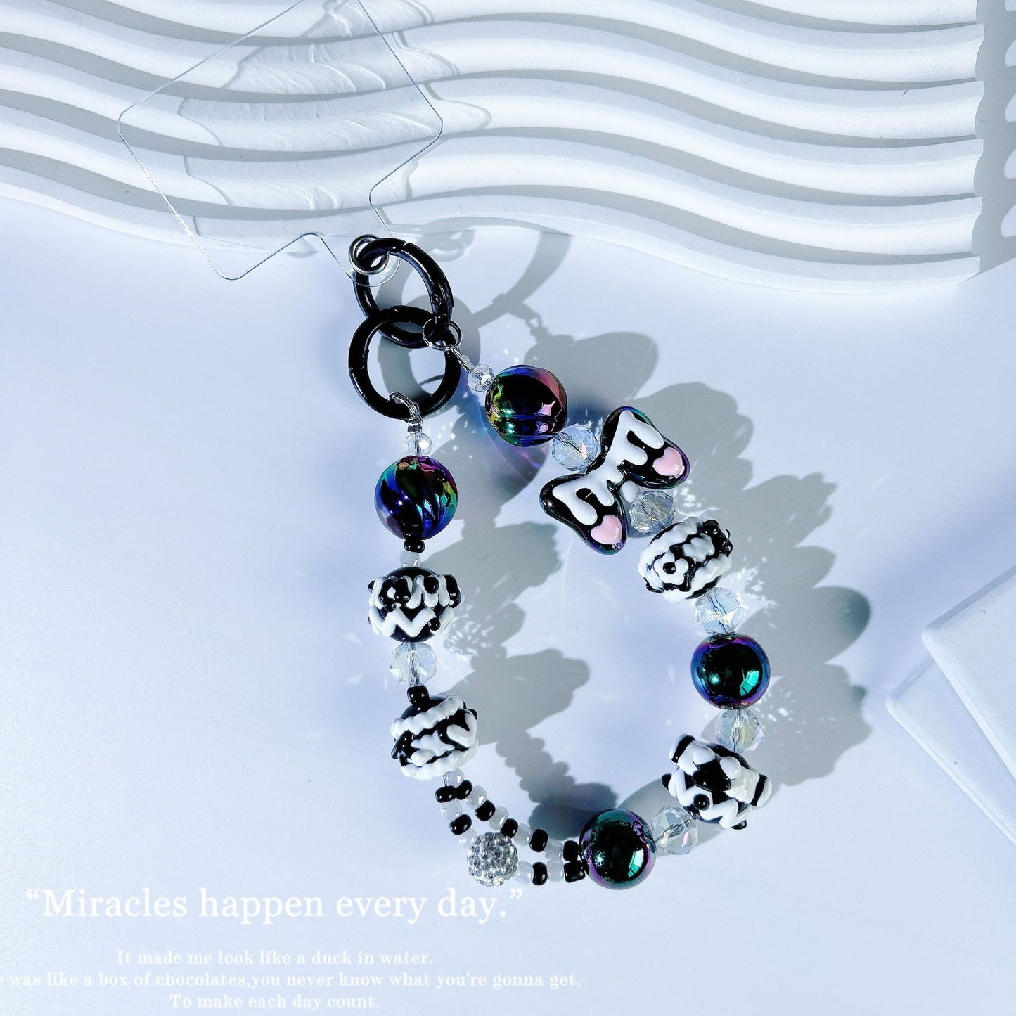 New crystal mobile phone chain pendant graffiti hand-painted bow bead string chain double buckle mobile phone case autumn and winter mobile phone chain